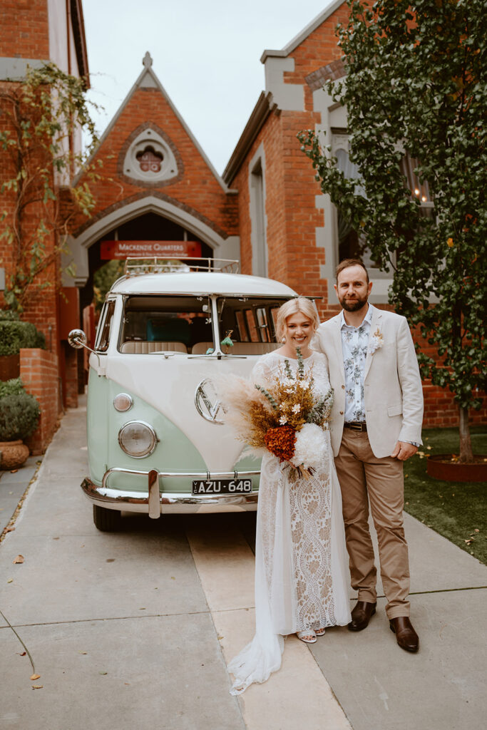 Married couple in front of MacKenzie Quarters wedding venue in Bendigo