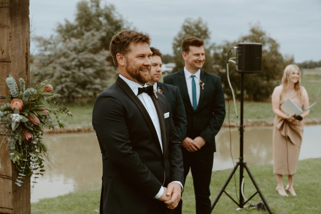 Groom's reaction during bride walking down the aisle