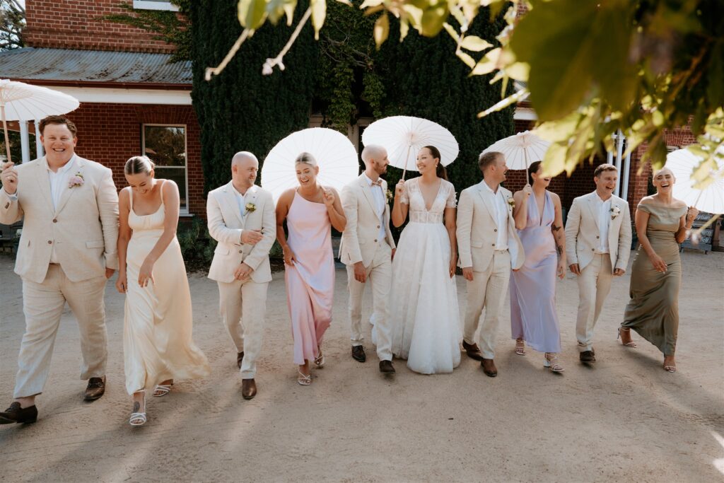 Wedding party walking in front of Ravenswood Homestead